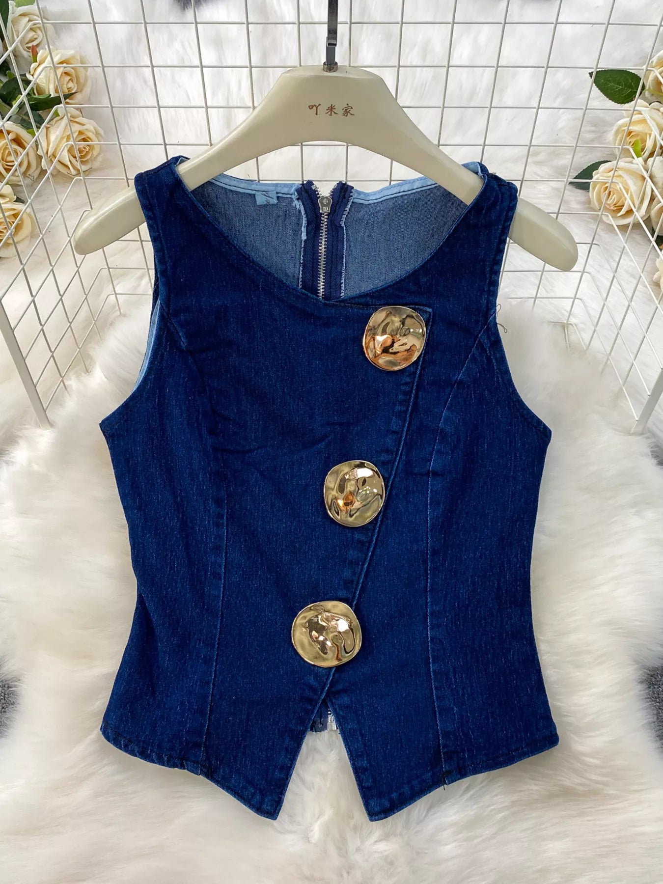 Button detail vest and flare jeans denim set by Plush Fashion Hub, featuring a stylish sleeveless top and high-waisted wide-leg jeans.