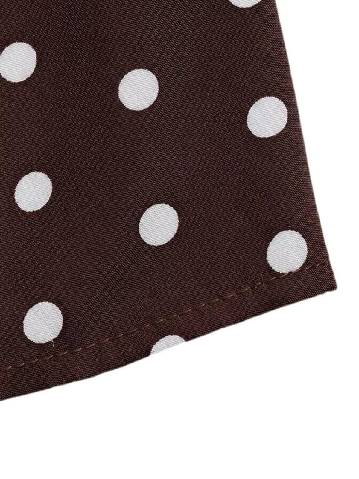 Polka dot halter neck mini dress by Plush Fashion Hub, featuring a stylish design with a fitted silhouette and playful pattern.