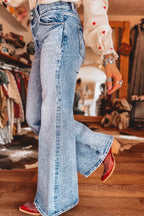 Acid wash flare jeans with pocket details by Shopimist, featuring a high-waisted fit and vintage-inspired denim style.