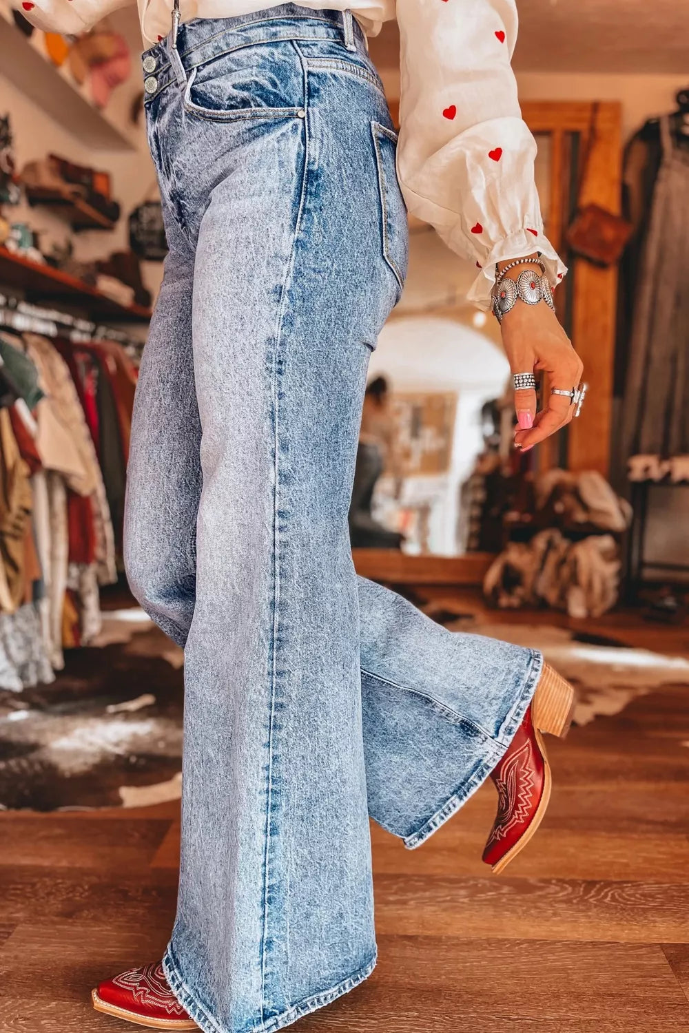 Acid wash flare jeans with pocket details by Shopimist, featuring a high-waisted fit and vintage-inspired denim style.