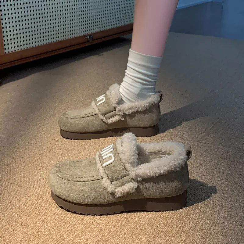 Faux fur suede slip-on footwear with round toe design, stylish and comfortable for casual wear, by Trendsi.