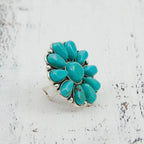 Artificial turquoise alloy flower ring with intricate floral design, featuring vibrant turquoise accents and a polished silver-tone finish.