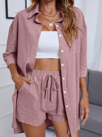 Women's casual button-up shirt and shorts two-piece set from Trendsi, featuring a relaxed fit and stylish design.
