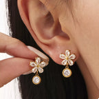 18K gold-plated stainless steel zircon flower drop earrings with intricate petal design and sparkling gemstones.