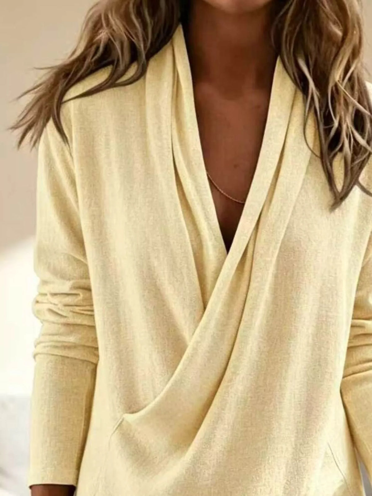 Plus size wrap-front long sleeve blouse from Trendsi, featuring a stylish fit and comfortable design.