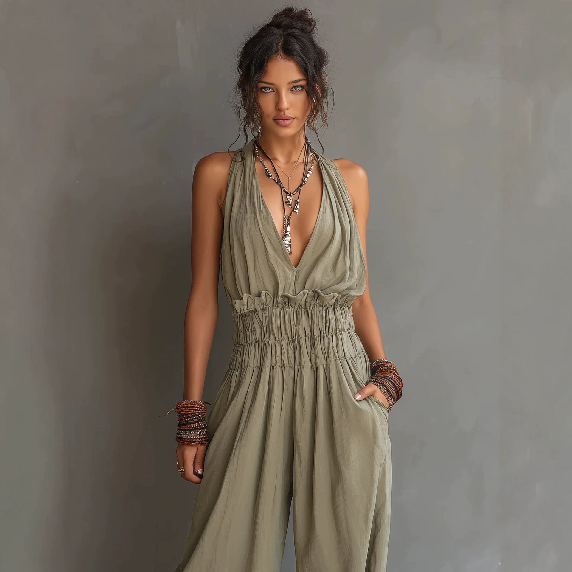 Women's sleeveless V-neck halter jumpsuit with open back and waist-cinching design by Plush Fashion Hub.