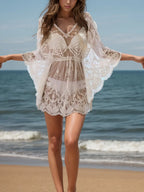 Lace V-neck three-quarter sleeve cover-up dress in delicate white lace, stylish and lightweight for beach or casual wear.