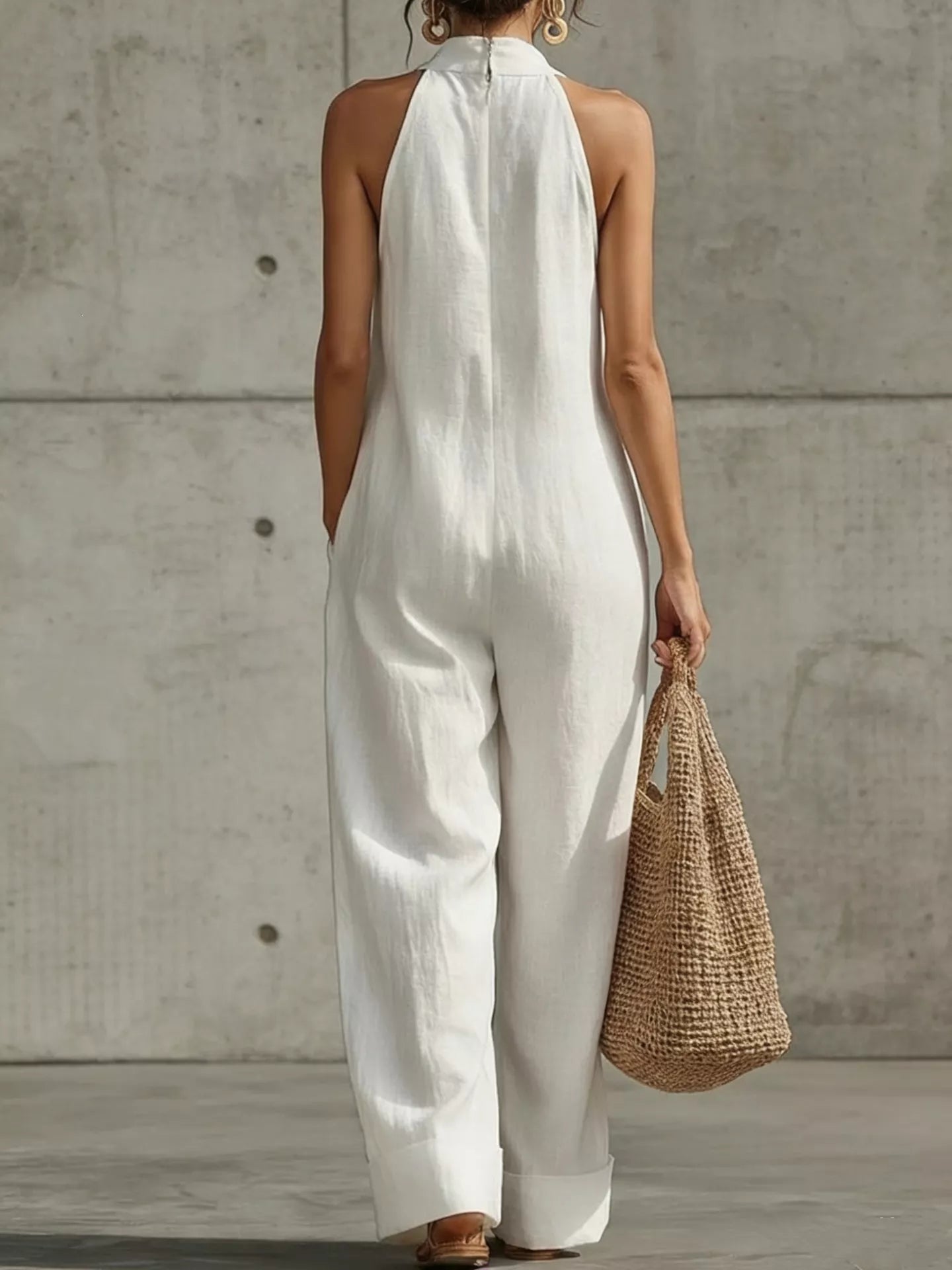Plus size halter neck wide-leg jumpsuit by Plush Fashion Hub, featuring a stylish full-size design and flattering fit.