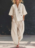 Plush Fashion Hub V-neck short sleeve top and high-waist trousers two-piece set, stylish and comfortable casual outfit.