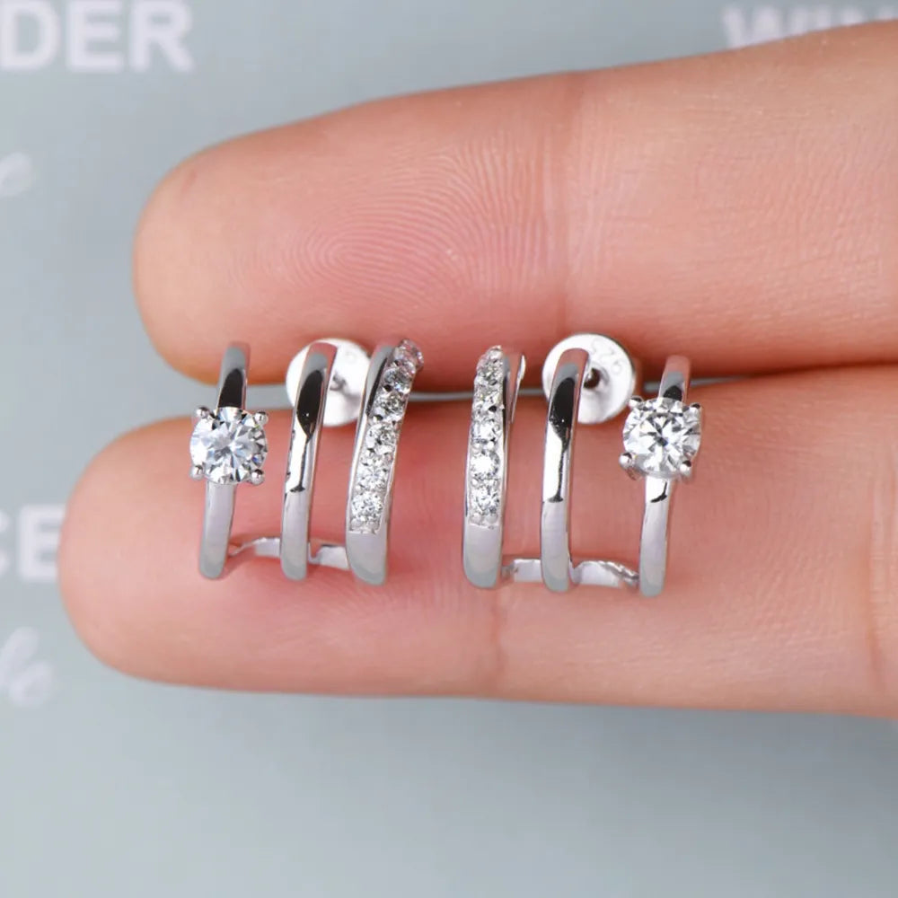 Sterling silver moissanite earrings with elegant design, showcasing sparkling gemstones and polished silver finish.