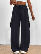 Women's high-waisted casual cargo pants with drawstring, lightweight utility pants from Trendsi, featuring multiple pockets and relaxed fit.