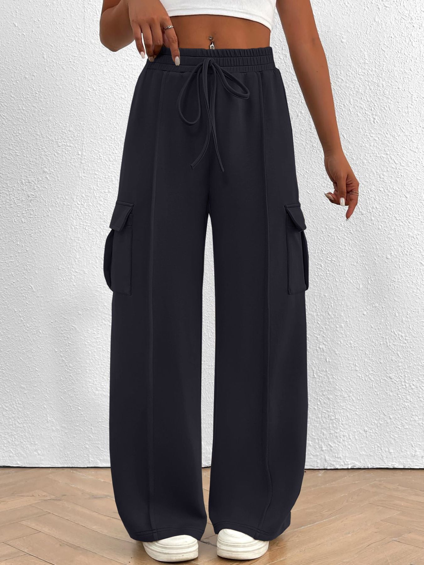 Women's high-waisted casual cargo pants with drawstring, lightweight utility pants from Trendsi, featuring multiple pockets and relaxed fit.