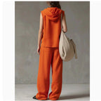 FitiqueFit sleeveless hooded top and wide-leg pants set, high-waist casualwear two-piece outfit, shown in a relaxed fit.