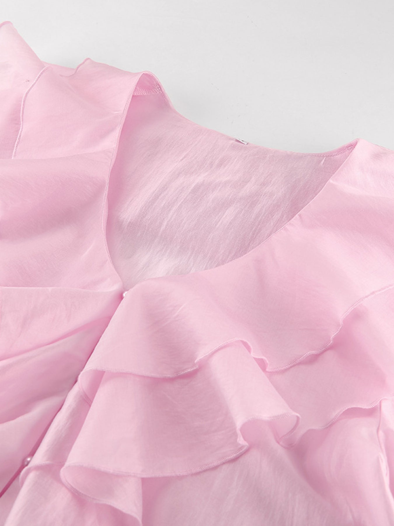 Women's elegant long sleeve blouse with ruffle trim, soft Tencel blend fabric, featuring a stylish and feminine design.