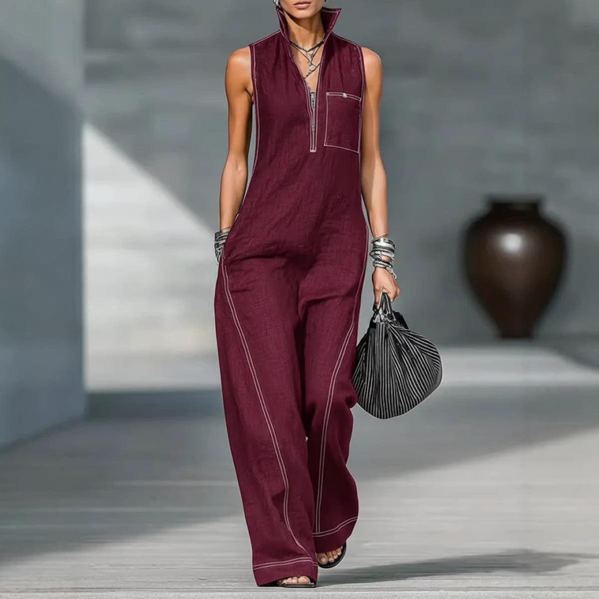 Women's sleeveless casual summer jumpsuit with stand-up collar and pockets, by Plush Fashion Hub, shown in a relaxed fit style.