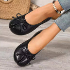Trendsi Bow Decor Split Toe Slip-On shoes in black featuring a bow detail and split toe design, casual slip-on style.