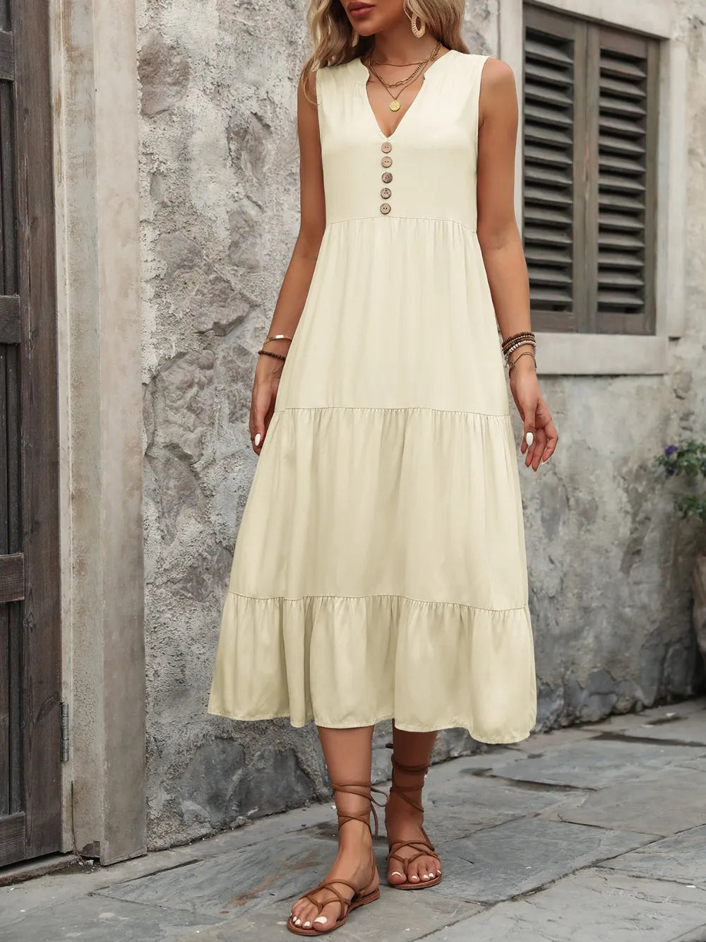 Ivy Lane women's sleeveless button-down dress with notched neck, made of 100% cotton, shown in a natural pose.
