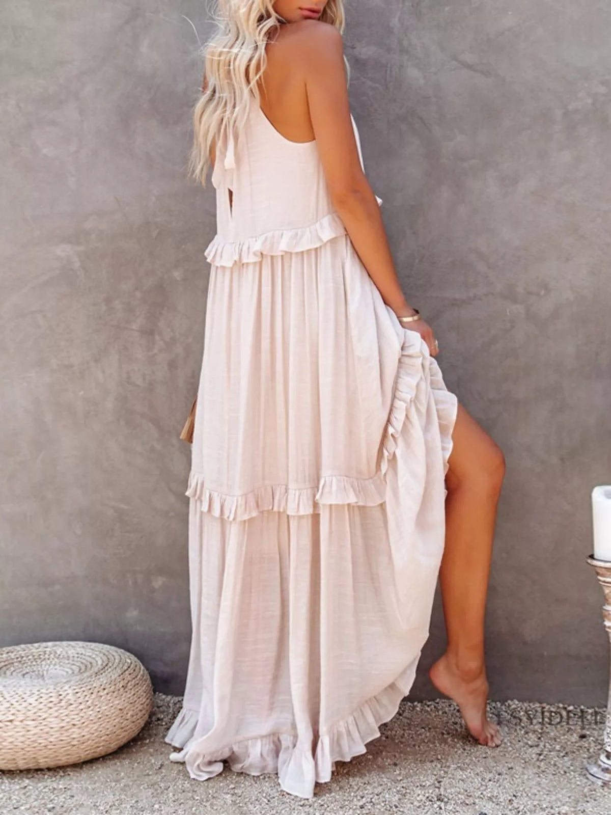 Ruffled tiered sleeveless maxi dress by Plush Fashion Hub featuring flowing fabric and a stylish layered design.