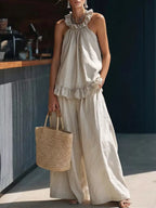 Plus size Shopimist ruffled halter neck top and wide-leg pants set, stylish two-piece outfit with flowy fabric and vibrant design.