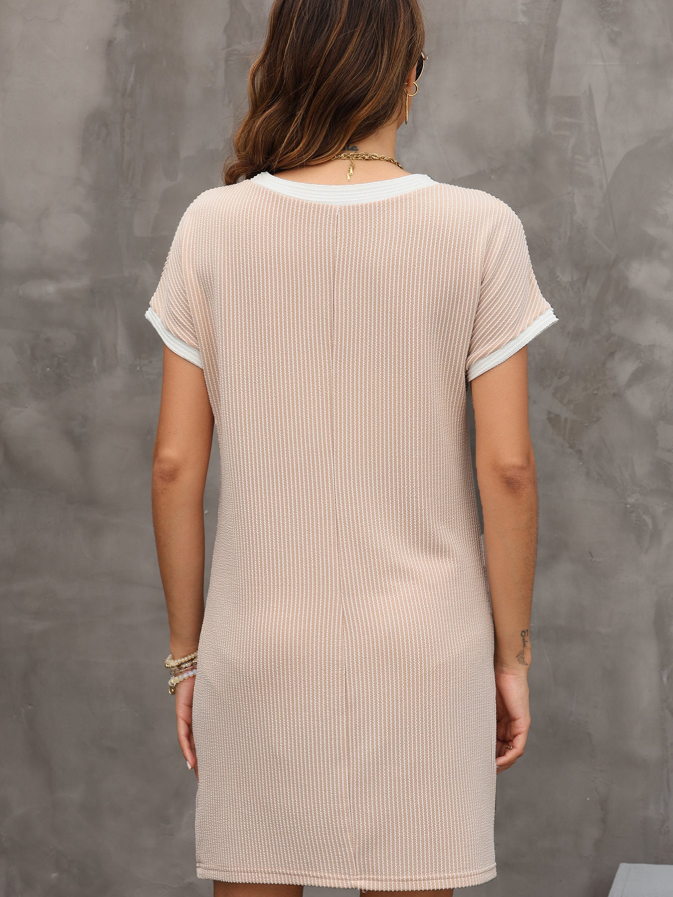 Women's ribbed color block T-shirt shift dress with pockets by Trendsi, showcasing a casual, comfortable silhouette.