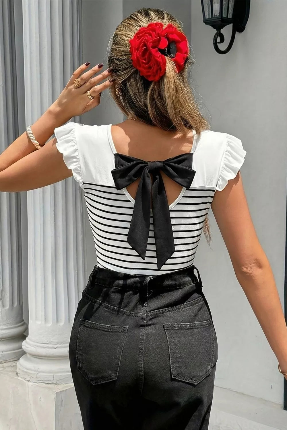 Plush Fashion Hub stripe contrast knot back ruffle trim tank top, featuring a stylish design with ruffles and a knot detail on the back.