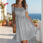 Women's off-shoulder striped waist-cinching midi dress by FitiqueFit, featuring casual wear style with a fitted waist and bold stripe pattern.