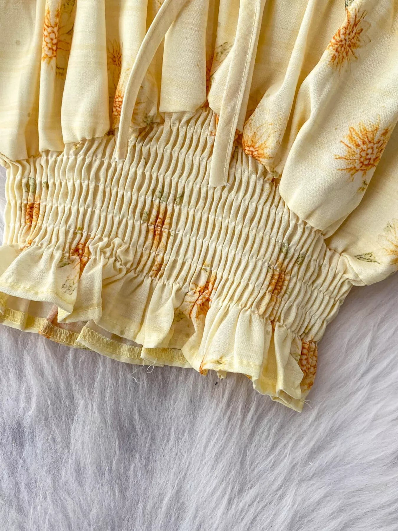 Shopimist smocked floral top and skirt set with ruffled details, perfect for a charming and feminine summer outfit.