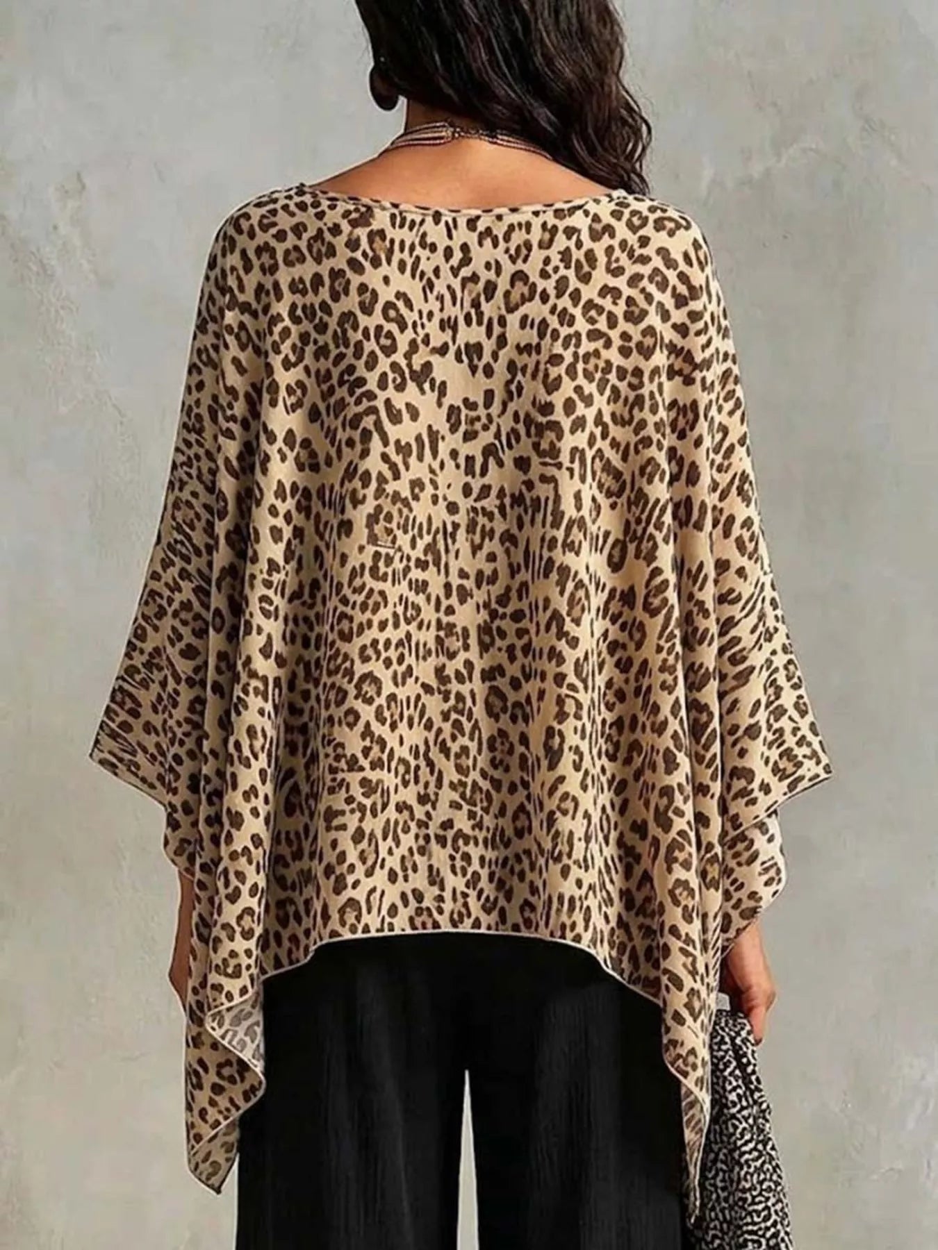 Plus size leopard print asymmetrical hem top by Plush Fashion Hub, showcasing a stylish, flowy design with bold animal print.