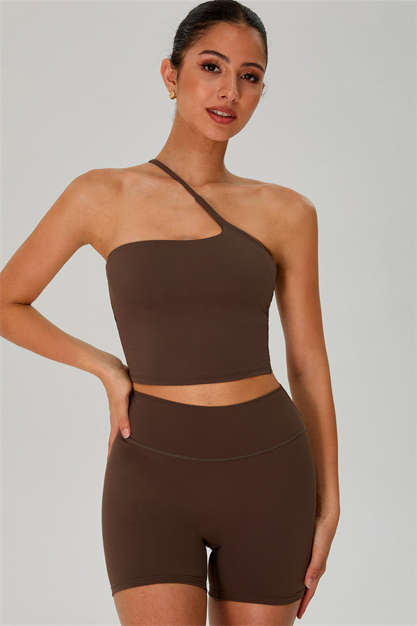 Fitglutes activewear one-shoulder crop top and matching shorts set, gym and workout sportswear, black and sleek design.