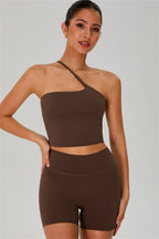 Fitglutes activewear one-shoulder crop top and matching shorts set, gym and workout sportswear, black and sleek design.