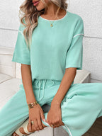 Women's casual two-piece lounge set with round neck top and drawstring pants, stylish and comfortable from Trendsi.