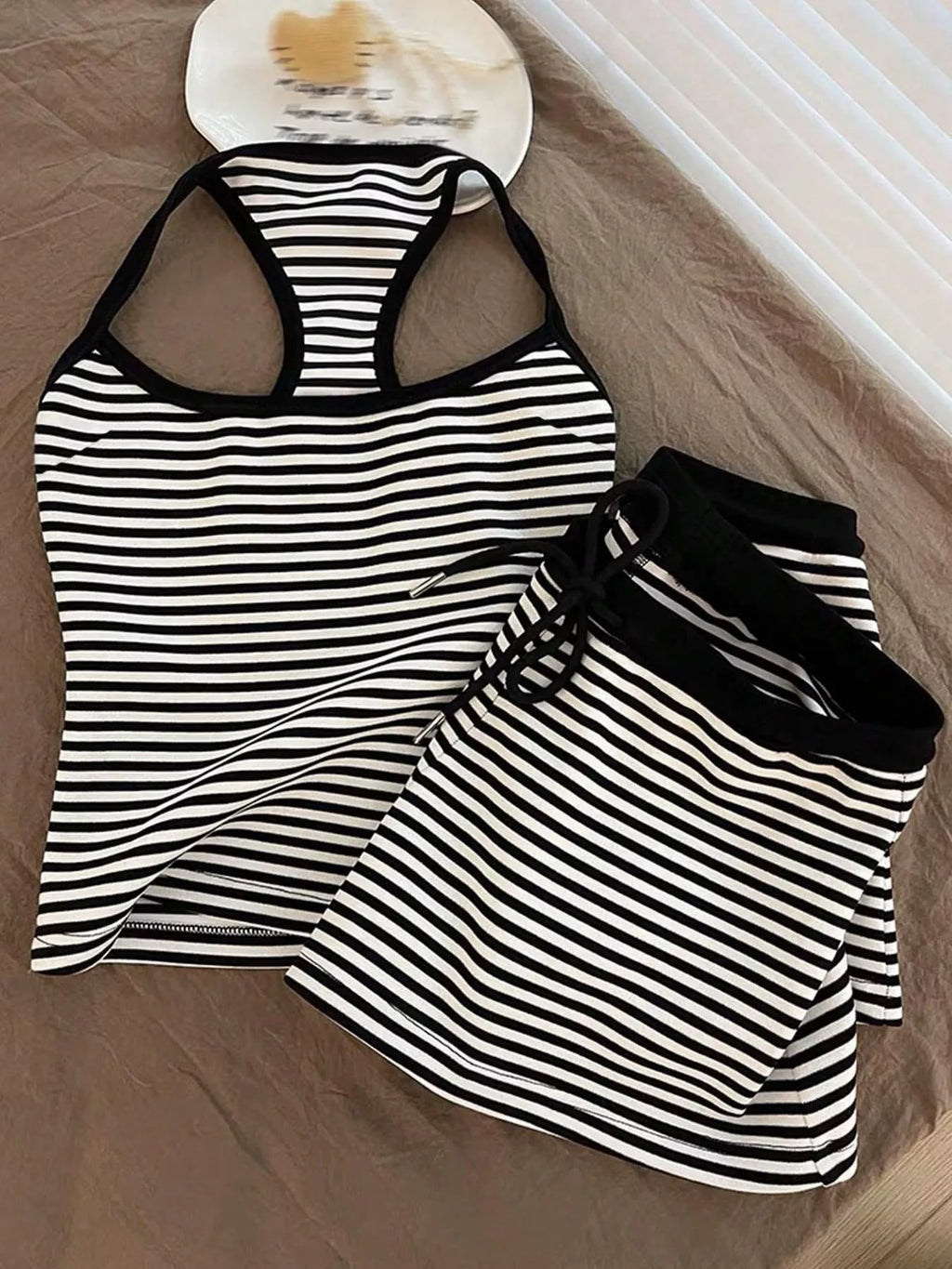 Striped tank top and shorts set by Trendsi, casual summer outfit with lightweight fabric and comfortable fit, visible in the image.