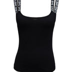 Women’s solid color sleeveless tank top by FitiqueFit, casualwear style, shown in a relaxed fit on a model.