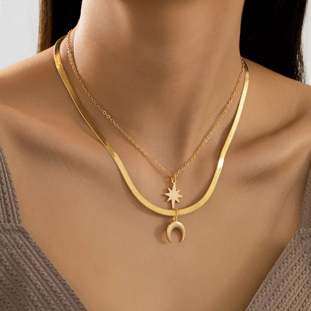 Gold-plated moon and star necklaces from Plush Fashion Hub, 2-piece set, featuring delicate celestial pendant designs.