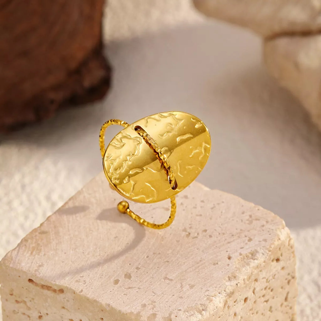 Hammered disc open ring from Shopimist featuring a textured, handcrafted silver design on a slim band.
