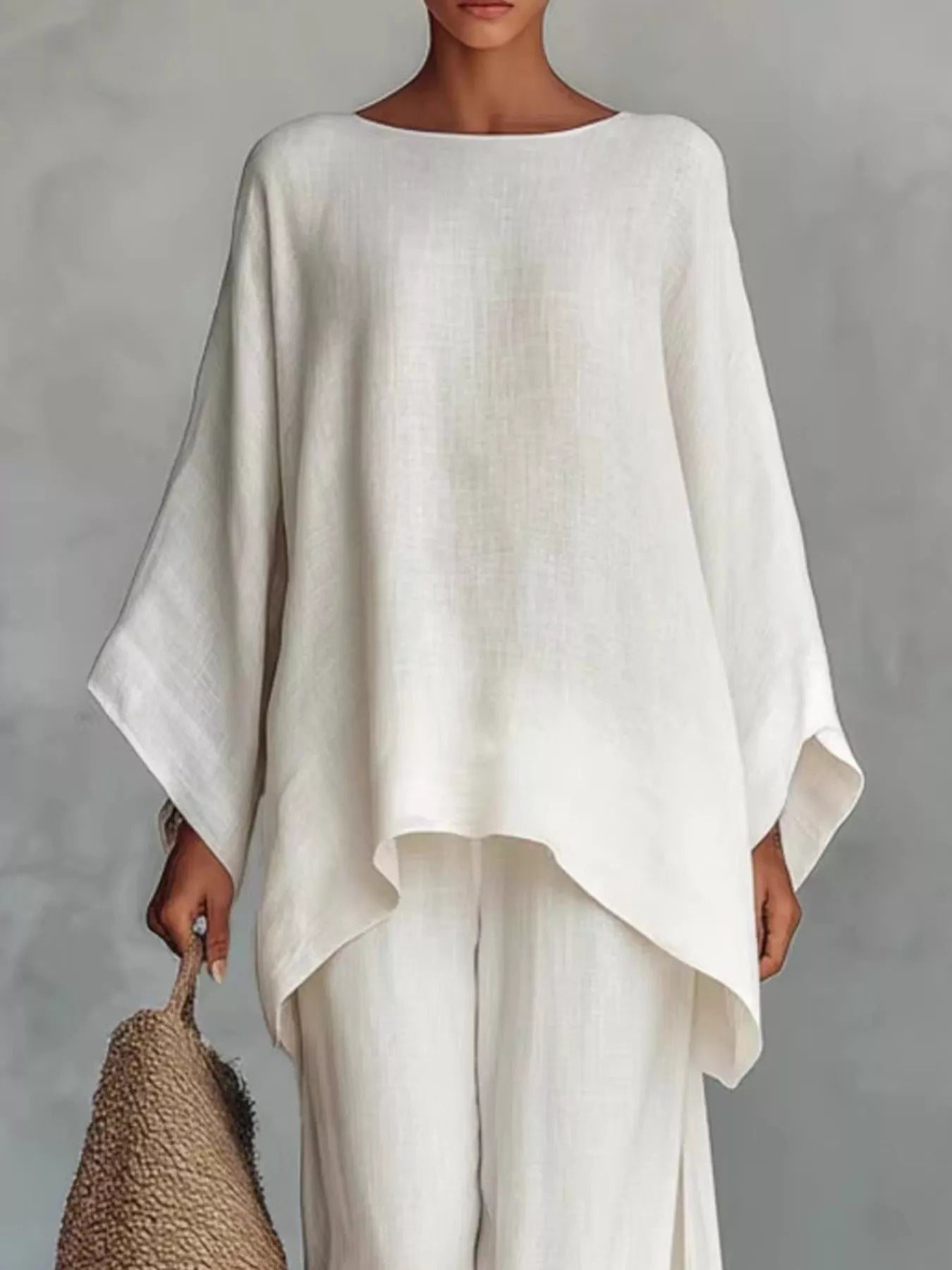 Plus size full size round neck top and wide leg pants set by Trendsi, featuring a comfortable, stylish matching outfit.