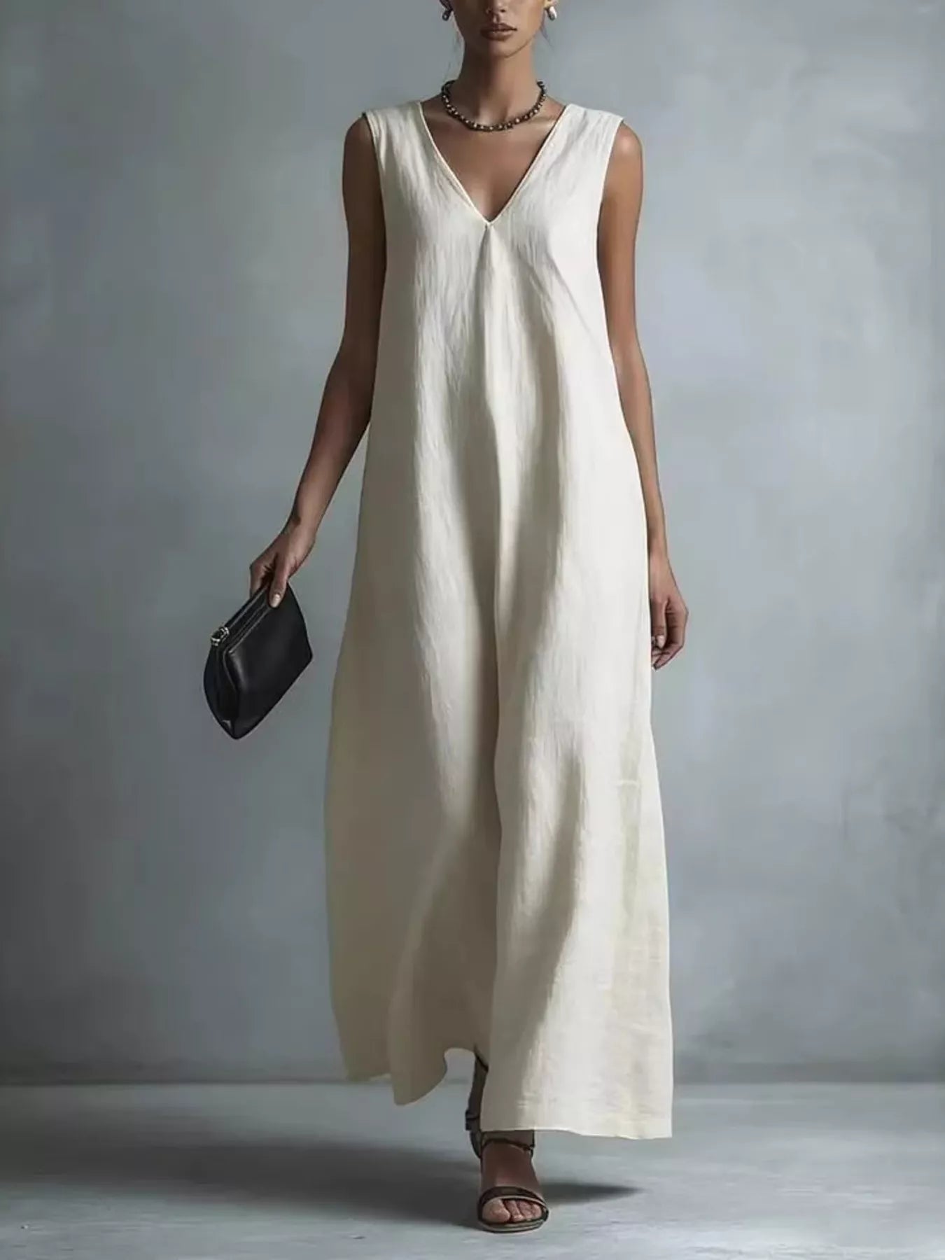 Plus size full V-neck sleeveless maxi dress by Plush Fashion Hub, flowing fabric and elegant design perfect for summer wear.