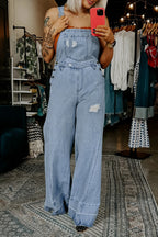 Women’s distressed wide-leg denim overalls from Plush Fashion Hub, casual relaxed fit jeans with a trendy, worn-in look.