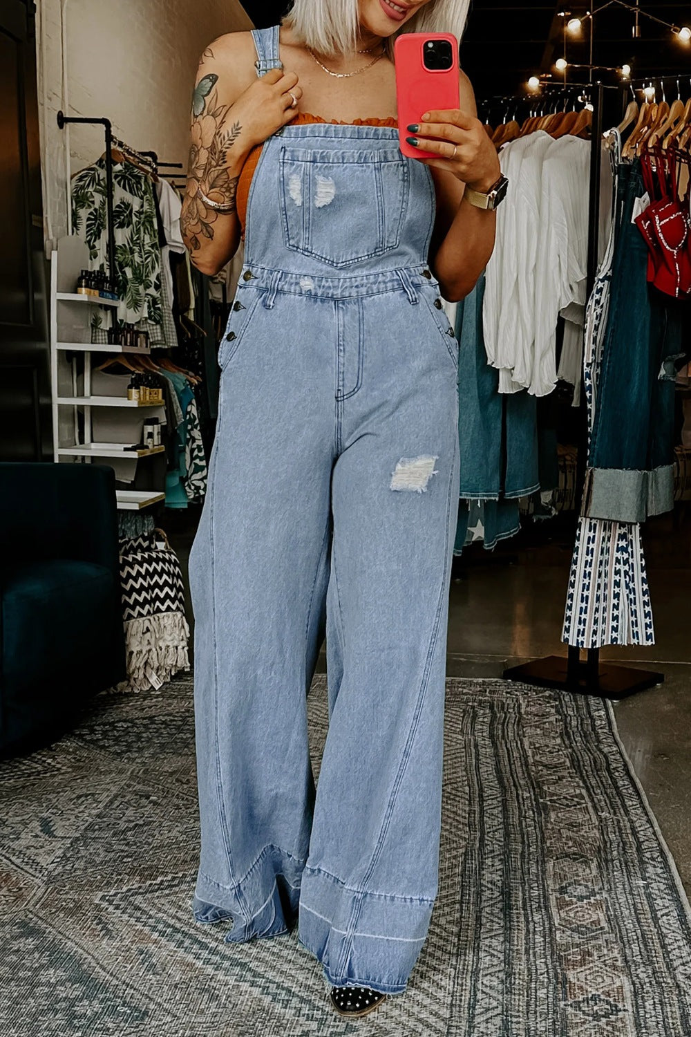 Women’s distressed wide-leg denim overalls from Plush Fashion Hub, casual relaxed fit jeans with a trendy, worn-in look.