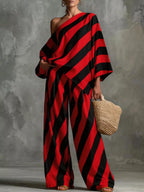 Plus size striped one-shoulder top and wide-leg pants set by Plush Fashion Hub, featuring a stylish, coordinated outfit.