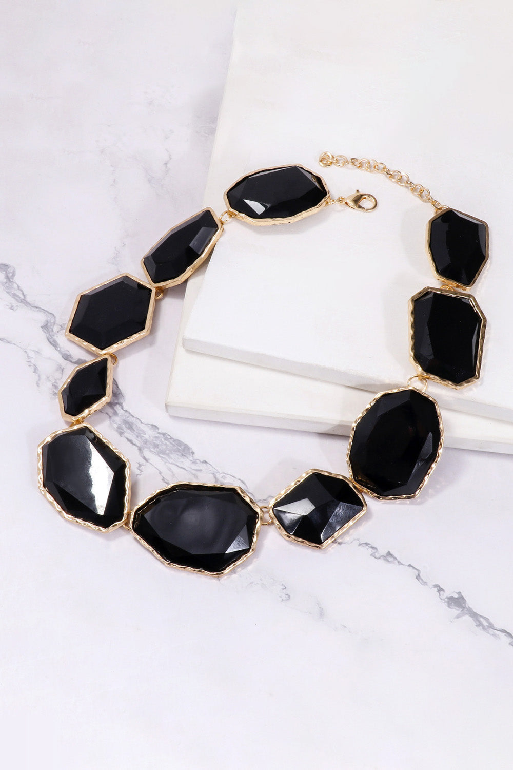 Geometrical resin necklace with zinc alloy frame, featuring colorful geometric shapes and modern jewelry design.