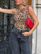 Leopard print asymmetrical ruched bodysuit by Trendsi, stylish animal print one-piece top with a fitted, ruched design.