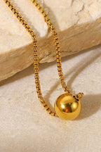 18K gold-plated round pendant necklace with a sleek, polished finish, featuring a delicate chain and elegant design.