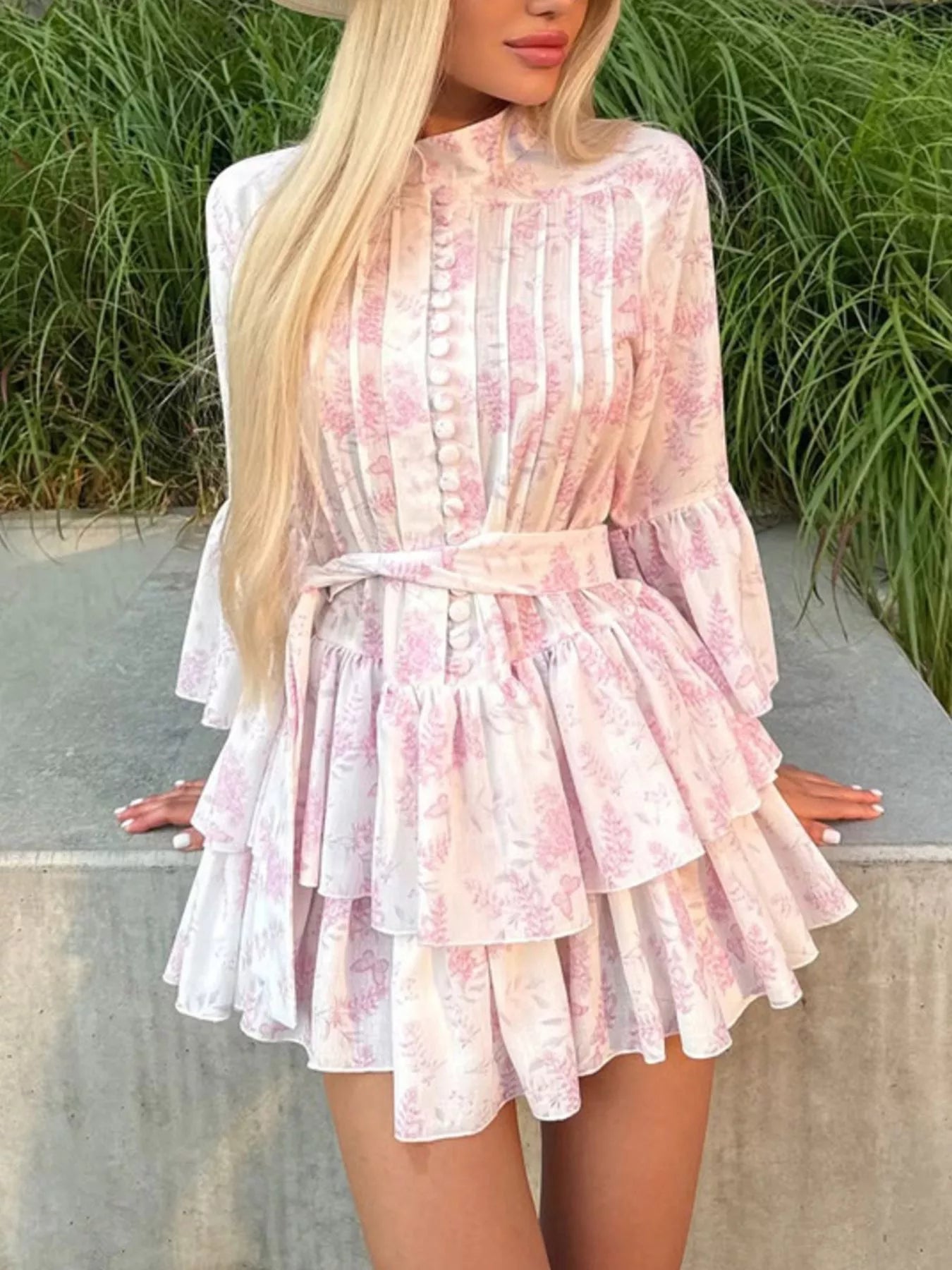 Floral print layered ruffle dress from Plush Fashion Hub featuring a feminine design with ruffles and vibrant floral patterns.