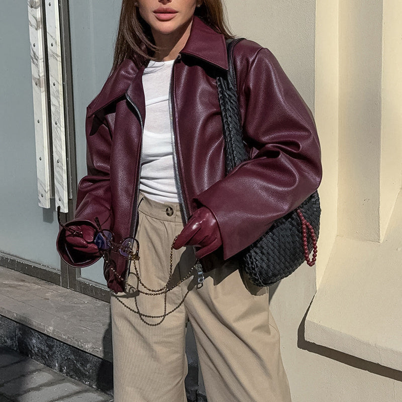 Vintage style women's solid color faux leather jacket from Plush Fashion Hub, showing front view with collar and long sleeves.