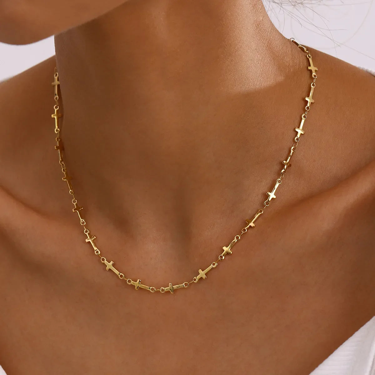 18K gold-plated cross necklace from Plush Fashion Hub, showcasing a delicate chain and detailed cross pendant.