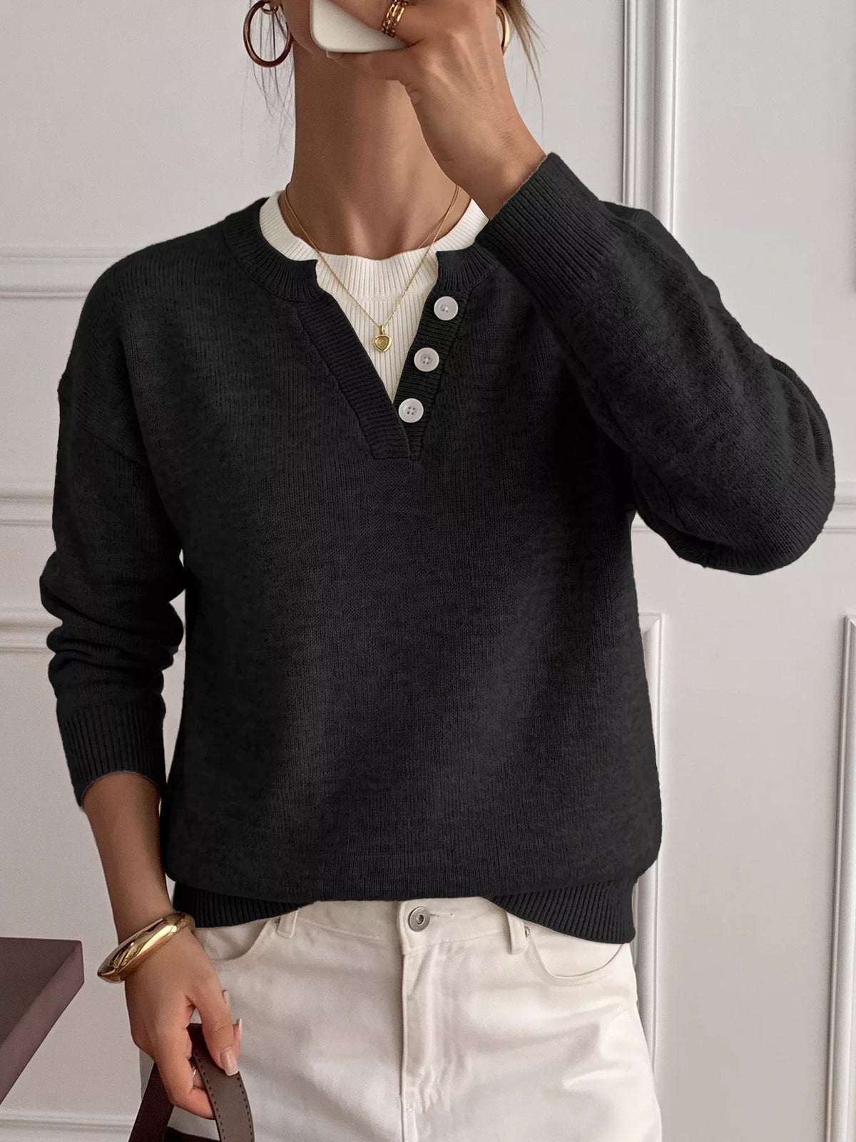 Ribbed knit sweater with button-placket detail from Trendsi, featuring a close-up of the textured fabric and button accents.