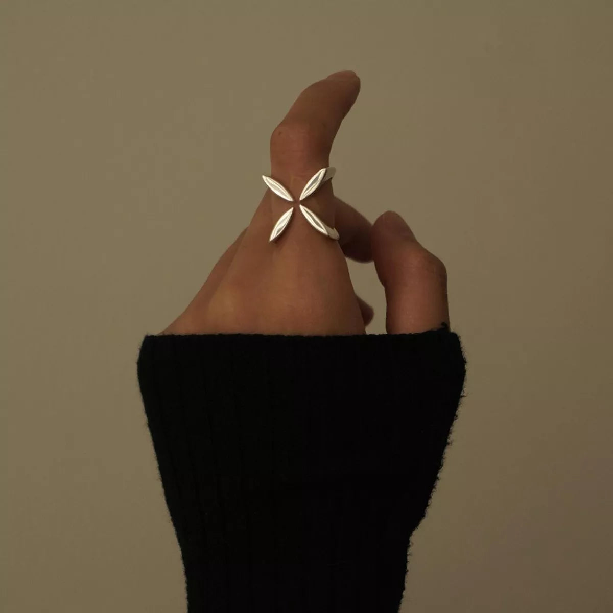 Stainless steel crisscross open ring from Plush Fashion Hub with sleek, shiny design and open-ended style.