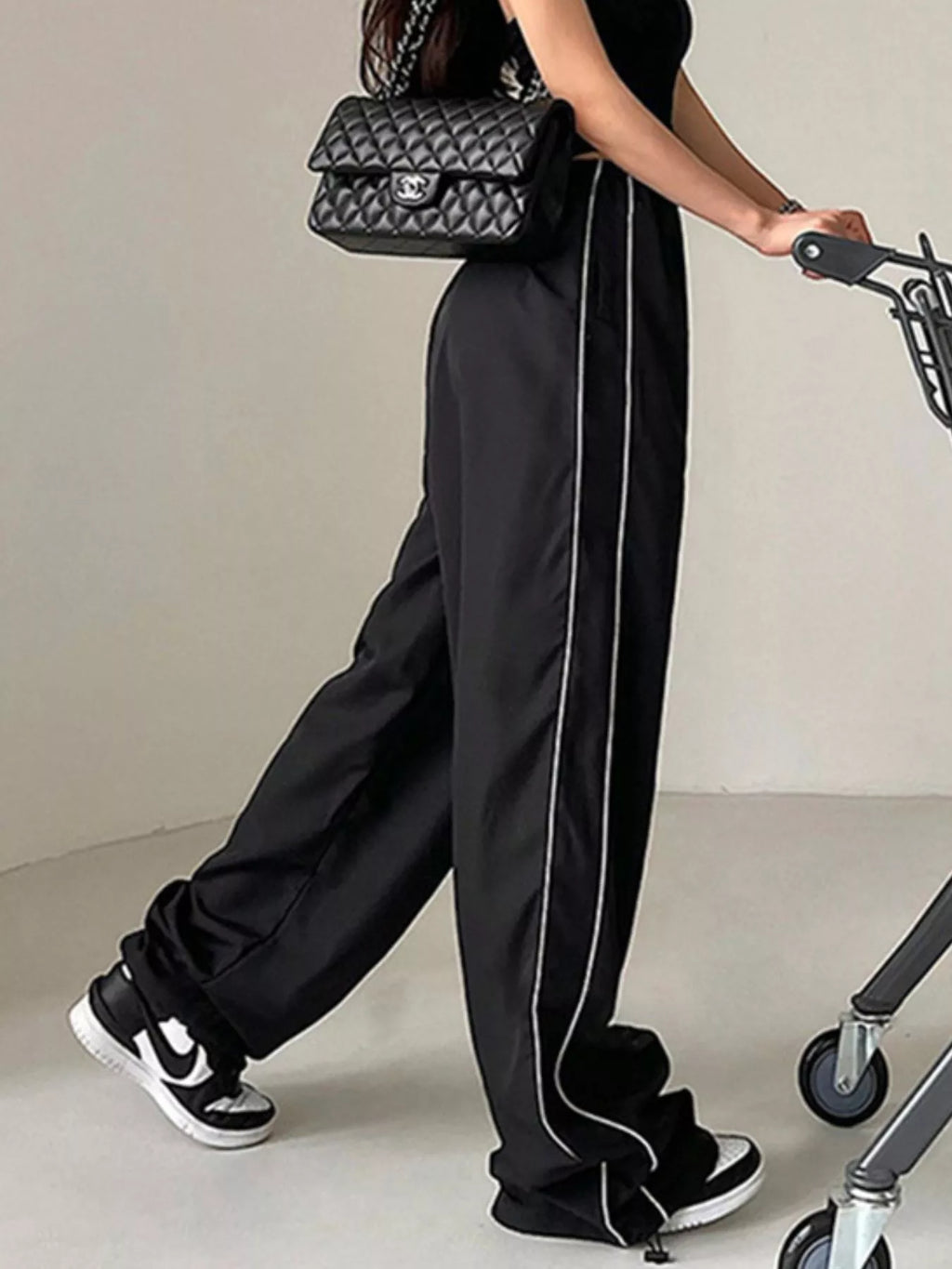 Women's high-rise wide-leg dress pants with lightweight fabric and elastic waist, stylish and comfortable from Trendsi.