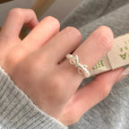Elegant Bow Pearl Beaded Ring from Shopimist featuring a delicate pearl and bead design on a sleek band.